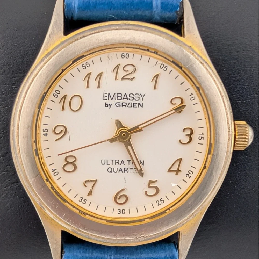 Embassy‎ by Gruen Ultra Thin Quartz Watch Gold Tone White Dial Blue Strap W1780